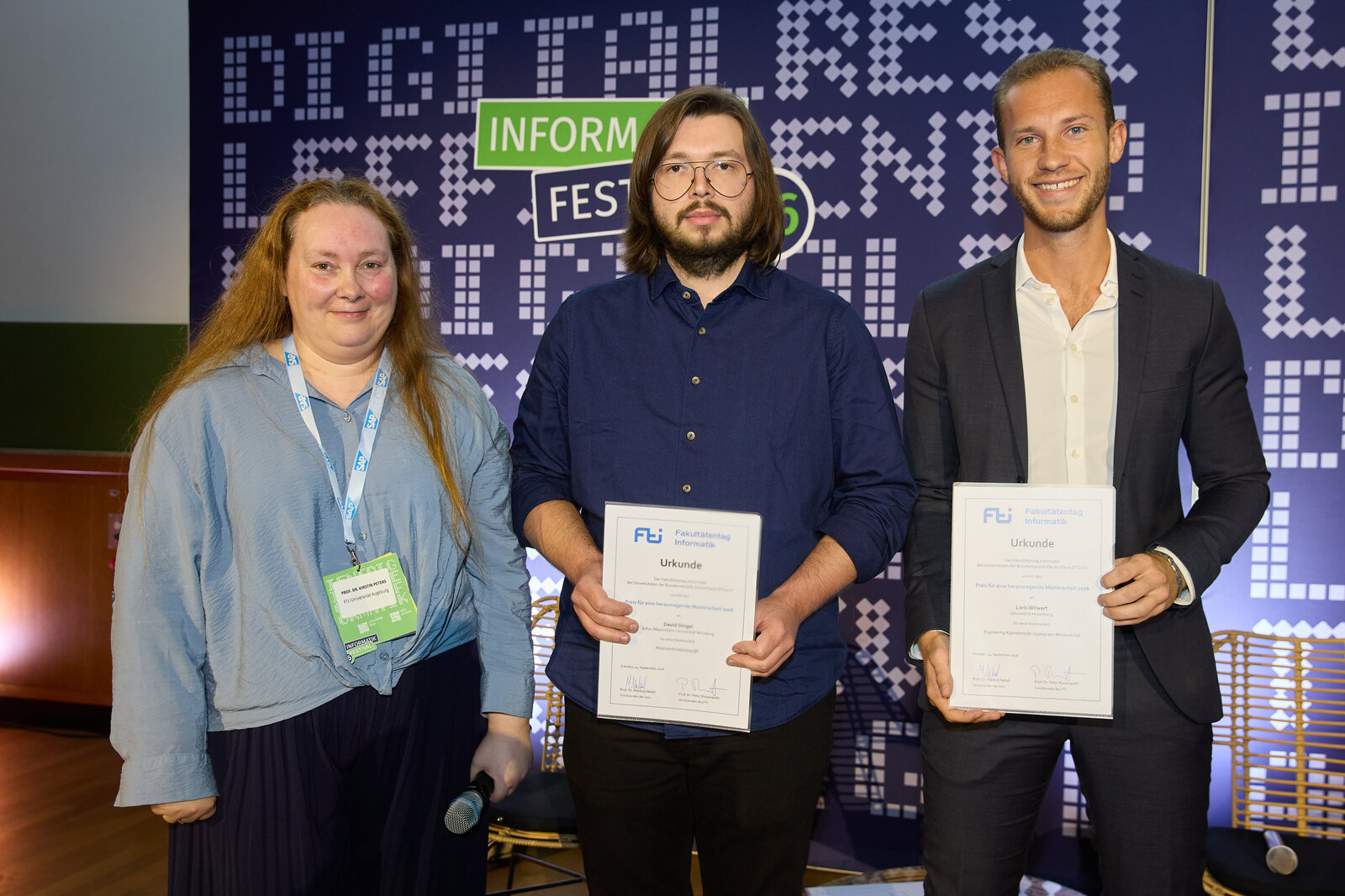 Loris Wilwert (right) receiving the FTI Prize 2026 at the Informatik Festival 2026